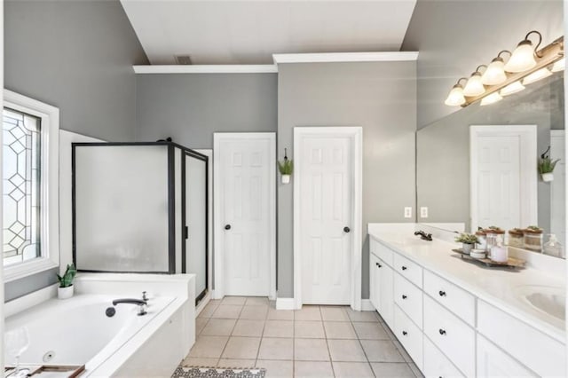 full bathroom featuring tile patterned flooring, a sink, double vanity, a tub with jets, and a stall shower