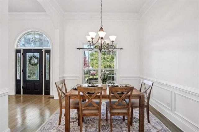 9435 Grande Dr, Winston, GA 30187 - dining space with wood finished floors, a notable chandelier, and ornamental molding