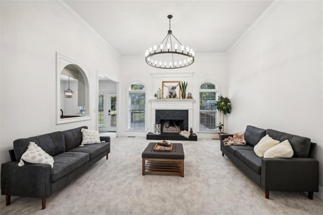 9435 Grande Dr, Winston, GA 30187 - living room with a chandelier, carpet floors, a fireplace with raised hearth, and crown molding