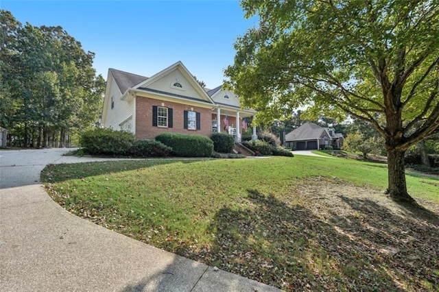 neoclassical / greek revival house with brick siding and a front lawn