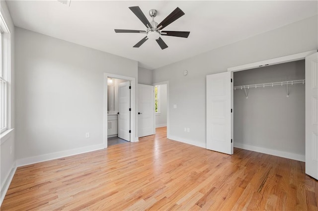 110 Hogue St, Atlanta, GA 30312 - unfurnished bedroom with light wood-style floors, a closet, baseboards, and ceiling fan