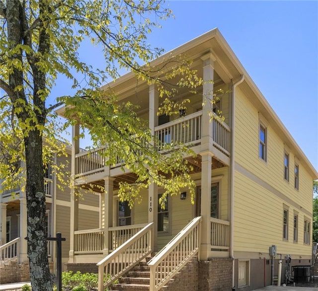 110 Hogue St, Atlanta, GA 30312 - rear view of house with a balcony, covered porch, and central air condition unit