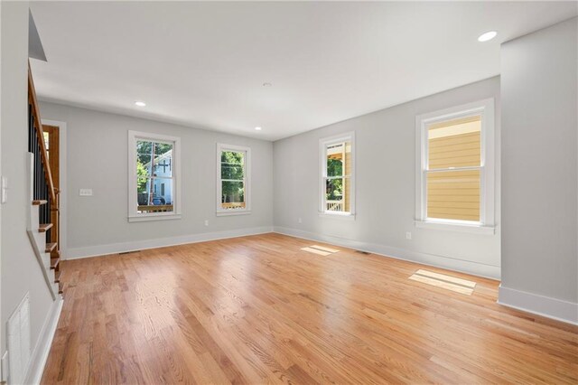 110 Hogue St, Atlanta, GA 30312 - empty room featuring light wood-style floors, baseboards, stairway, and recessed lighting