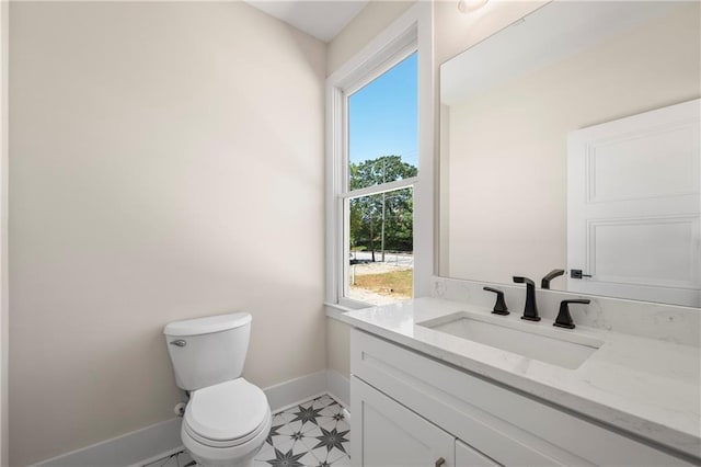 110 Hogue St, Atlanta, GA 30312 - bathroom featuring baseboards, vanity, plenty of natural light, and toilet