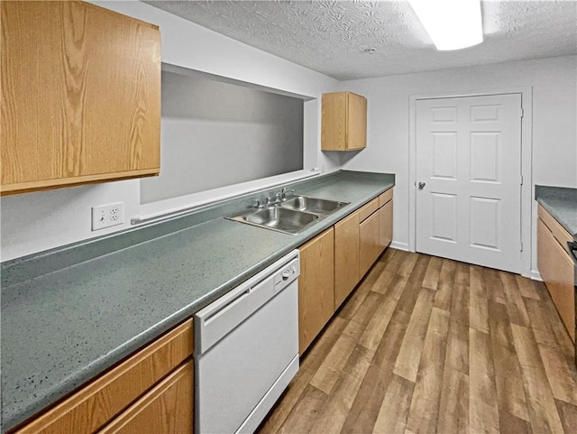 kitchen featuring a textured ceiling, dishwasher, light wood-type flooring, and sink