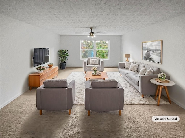 carpeted living room featuring ceiling fan and a textured ceiling