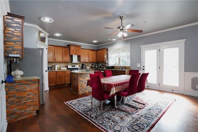dining area with recessed lighting, ornamental molding, a ceiling fan, and dark wood-style flooring