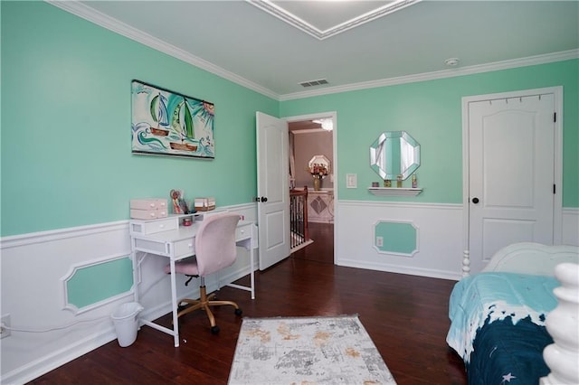 bedroom featuring visible vents, wainscoting, crown molding, and wood finished floors