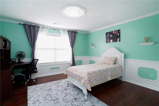 bedroom featuring baseboards, visible vents, ornamental molding, and wood finished floors