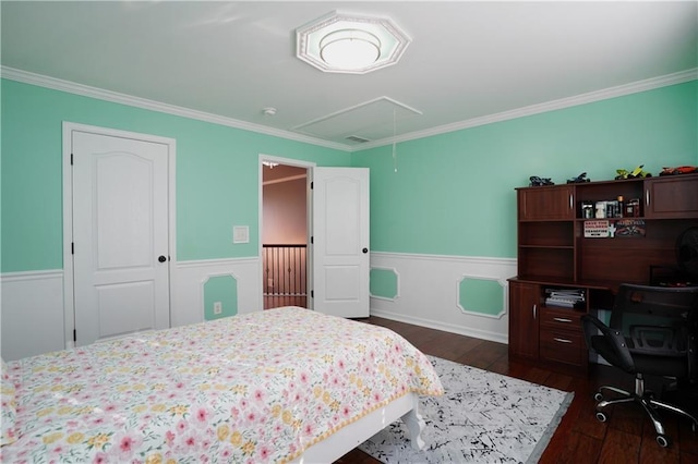 bedroom featuring crown molding, a wainscoted wall, attic access, and dark wood-style flooring