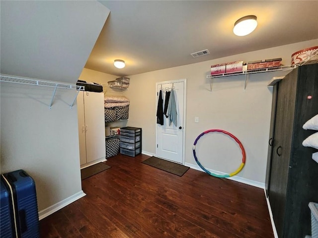 walk in closet featuring visible vents and hardwood / wood-style floors
