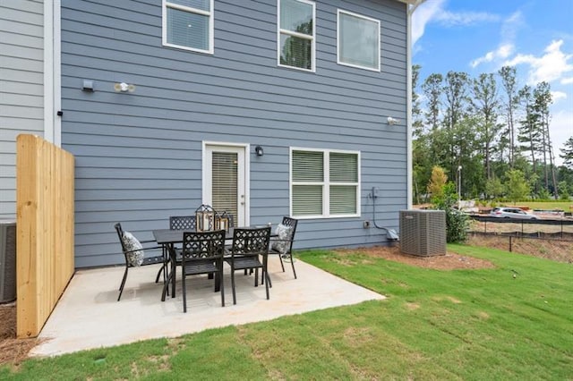 rear view of house with a patio and central air condition unit