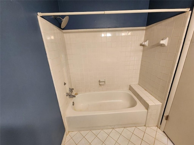 bathroom with tile patterned floors and tiled shower / bath