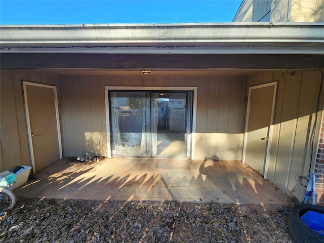 property entrance with a patio area