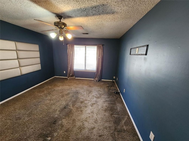 unfurnished room featuring ceiling fan, a textured ceiling, vaulted ceiling, and carpet flooring