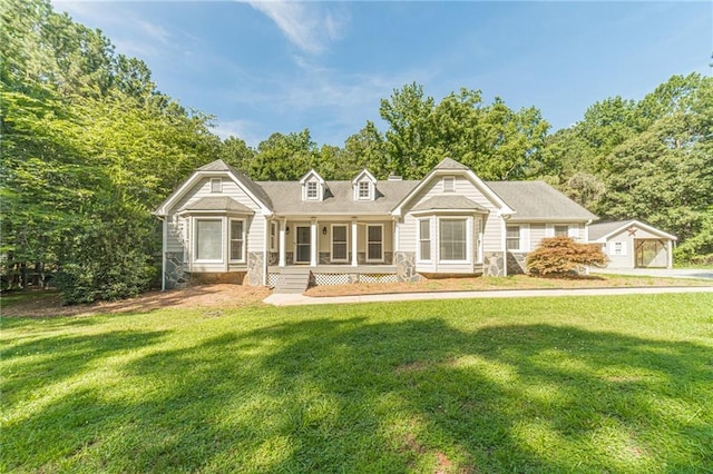 4120 Grady Smith Rd, Loganville, GA 30052 - view of front of house with a porch, a front yard, and stone siding