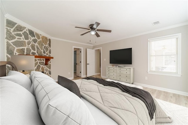 4120 Grady Smith Rd, Loganville, GA 30052 - bedroom featuring crown molding, light wood-type flooring, a spacious closet, and a ceiling fan