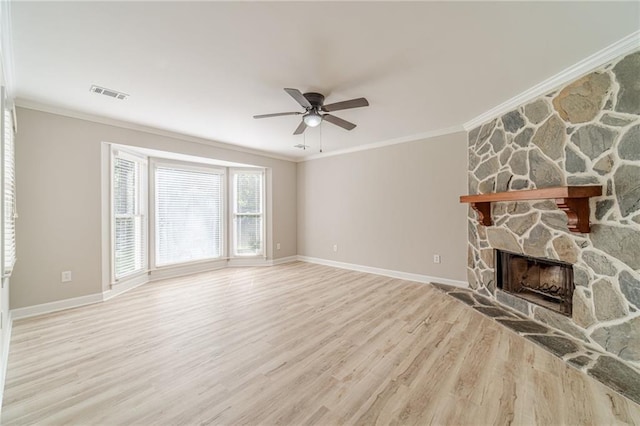 4120 Grady Smith Rd, Loganville, GA 30052 - unfurnished living room with ornamental molding, ceiling fan, wood finished floors, and a fireplace
