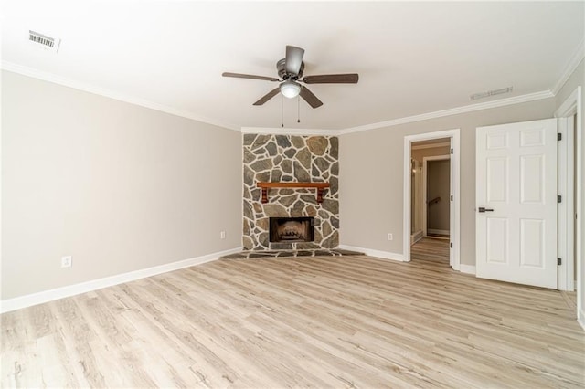 4120 Grady Smith Rd, Loganville, GA 30052 - unfurnished living room featuring a ceiling fan, light wood-type flooring, crown molding, and a fireplace