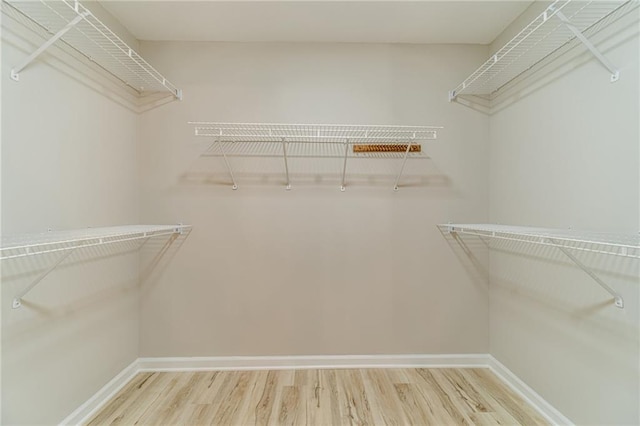 4120 Grady Smith Rd, Loganville, GA 30052 - walk in closet featuring wood finished floors