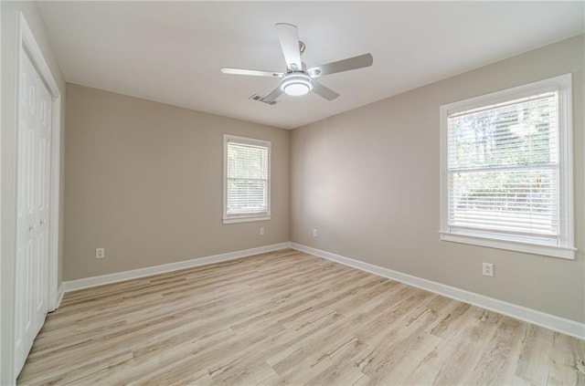 4120 Grady Smith Rd, Loganville, GA 30052 - unfurnished bedroom with light wood finished floors, a closet, and a ceiling fan