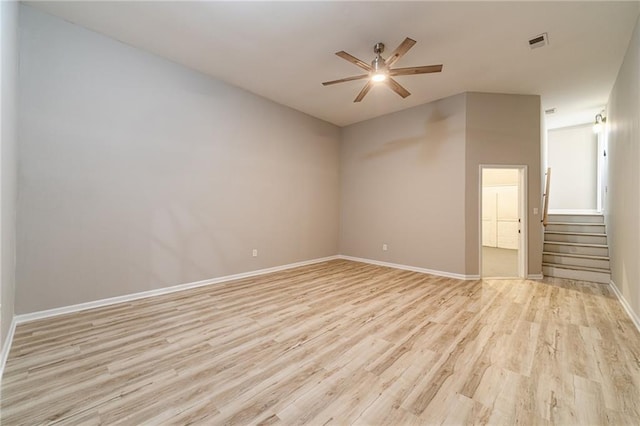 4120 Grady Smith Rd, Loganville, GA 30052 - empty room featuring ceiling fan, light wood-style floors, and stairs
