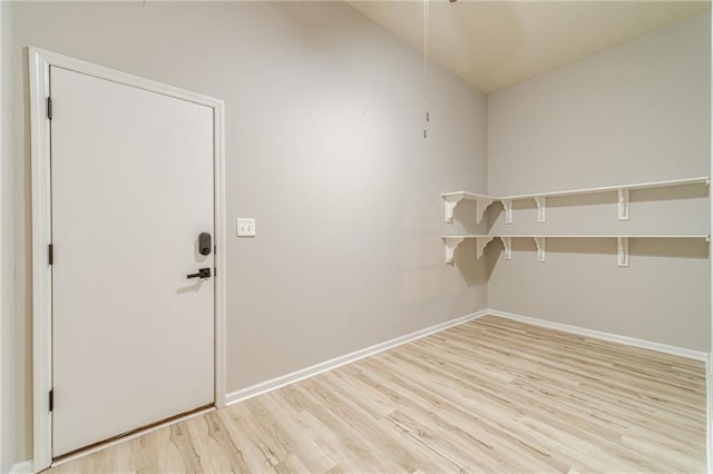 4120 Grady Smith Rd, Loganville, GA 30052 - spacious closet featuring light wood-style floors and vaulted ceiling