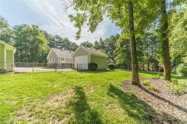 4120 Grady Smith Rd, Loganville, GA 30052 - view of yard featuring a detached garage and view of wooded area