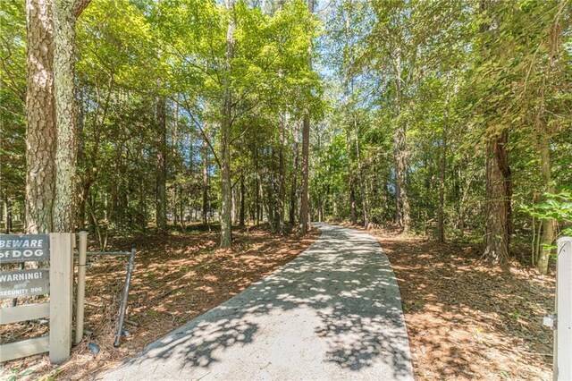 4120 Grady Smith Rd, Loganville, GA 30052 - view of road featuring a forest view