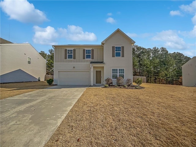 view of front property featuring a front lawn and a garage