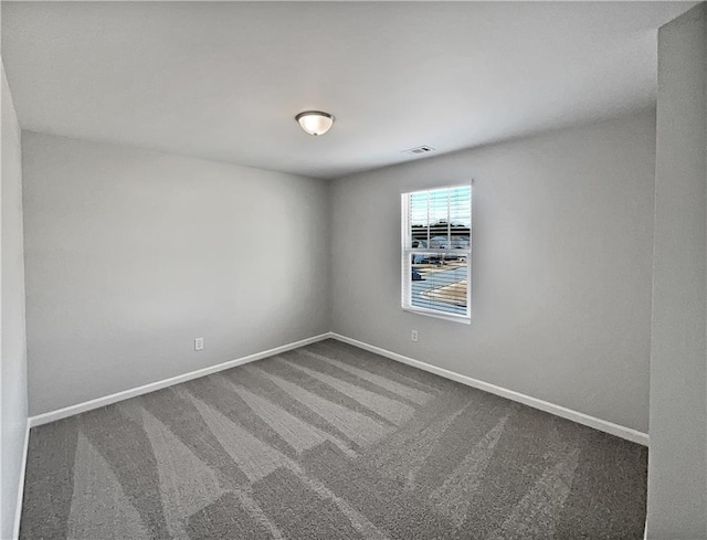 empty room featuring carpet flooring