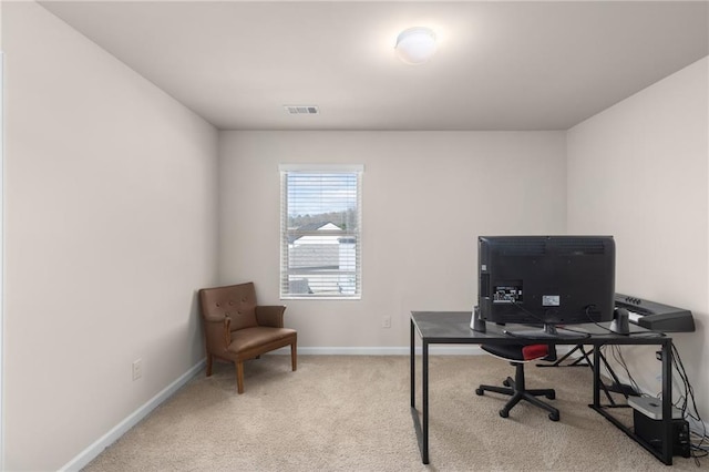 office space with baseboards, carpet floors, and visible vents