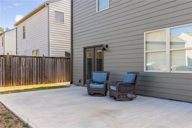 view of patio / terrace featuring fence