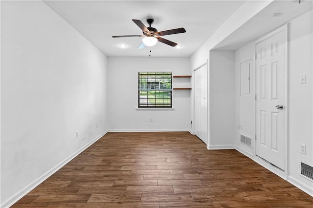 2568 Redfield Dr, Norcross, GA 30071 - unfurnished bedroom featuring dark wood-type flooring, baseboards, and ceiling fan