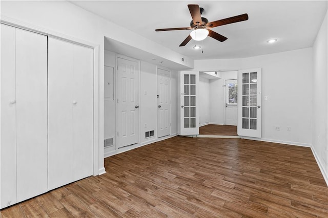 2568 Redfield Dr, Norcross, GA 30071 - unfurnished bedroom featuring french doors, baseboards, wood finished floors, recessed lighting, and a ceiling fan