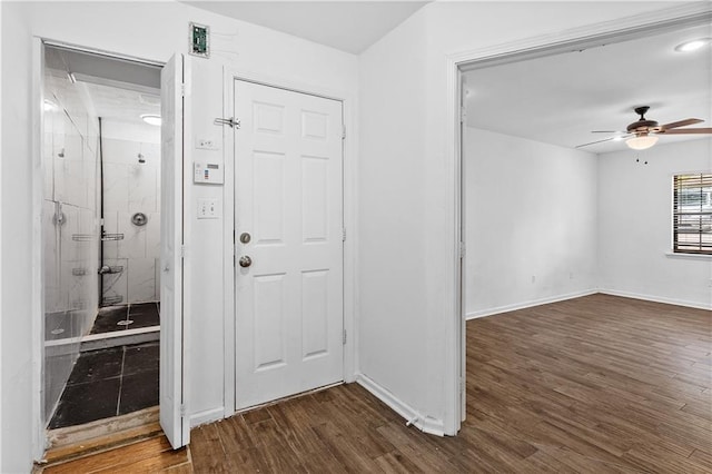 2568 Redfield Dr, Norcross, GA 30071 - entrance foyer featuring ceiling fan, dark wood finished floors, and baseboards