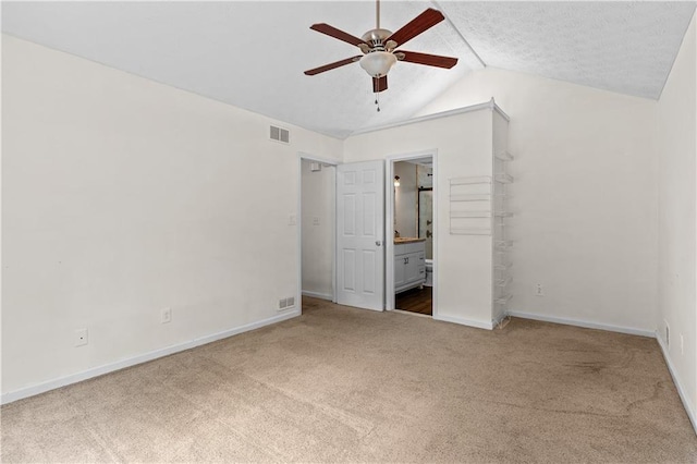 2568 Redfield Dr, Norcross, GA 30071 - unfurnished bedroom with carpet floors, baseboards, vaulted ceiling, and connected bathroom