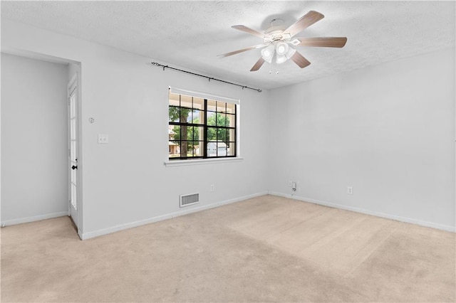 2568 Redfield Dr, Norcross, GA 30071 - empty room with light carpet, a textured ceiling, ceiling fan, and baseboards