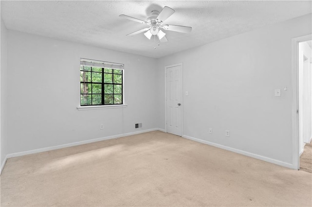 2568 Redfield Dr, Norcross, GA 30071 - empty room featuring light carpet, a ceiling fan, a textured ceiling, and baseboards