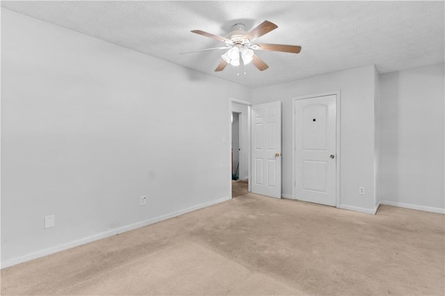 2568 Redfield Dr, Norcross, GA 30071 - unfurnished bedroom with carpet flooring, baseboards, a textured ceiling, and a ceiling fan