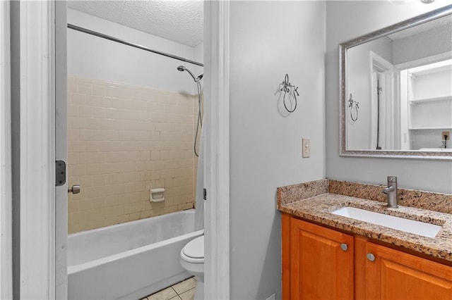 2568 Redfield Dr, Norcross, GA 30071 - full bathroom with vanity,  shower combination, toilet, tile patterned floors, and a textured ceiling