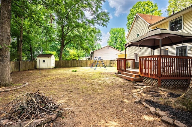 2568 Redfield Dr, Norcross, GA 30071 - fenced backyard with a wooden deck, a playground, and a gazebo