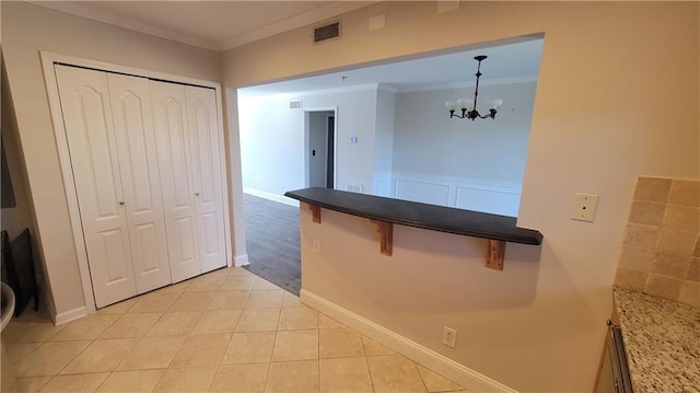 2825 NE Expy NE Unit # F3, Atlanta, GA 30345 - corridor featuring a chandelier, ornamental molding, light tile patterned floors, and baseboards