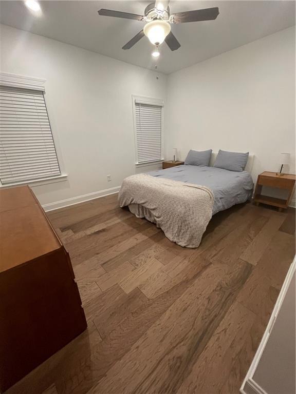 bedroom featuring ceiling fan and hardwood / wood-style flooring