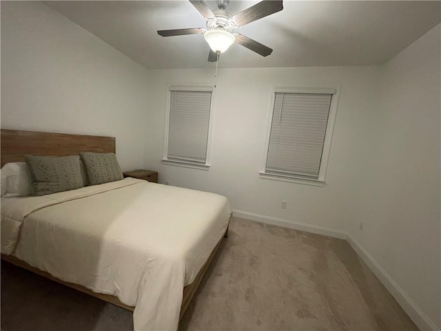 bedroom featuring ceiling fan and light carpet