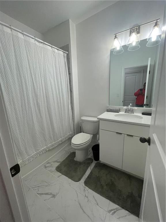 full bathroom with vanity, toilet, and shower / tub combo with curtain