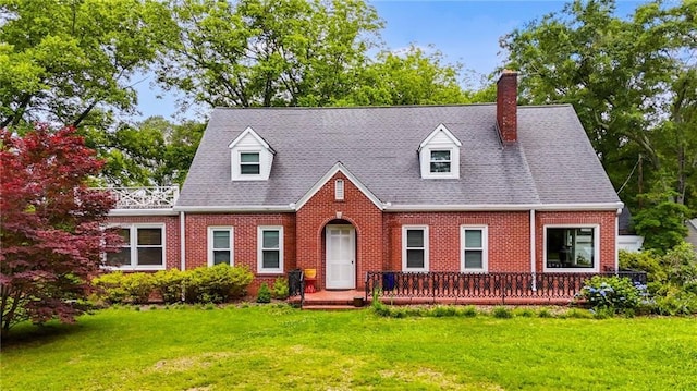 407 E College St E, Bowdon, GA 30108 - cape cod-style house featuring brick siding, a front yard, and a chimney