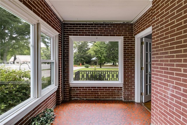 407 E College St E, Bowdon, GA 30108 - unfurnished sunroom featuring brick wall