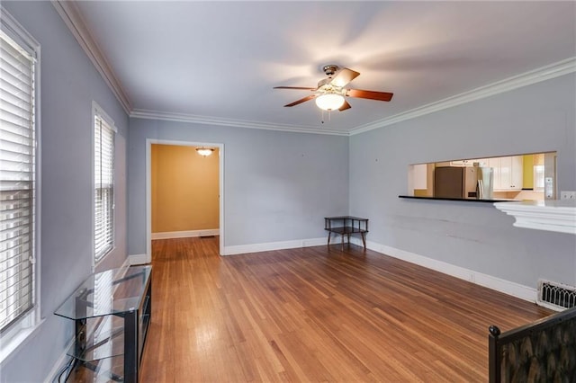 407 E College St E, Bowdon, GA 30108 - living area featuring ceiling fan, wood finished floors, and crown molding