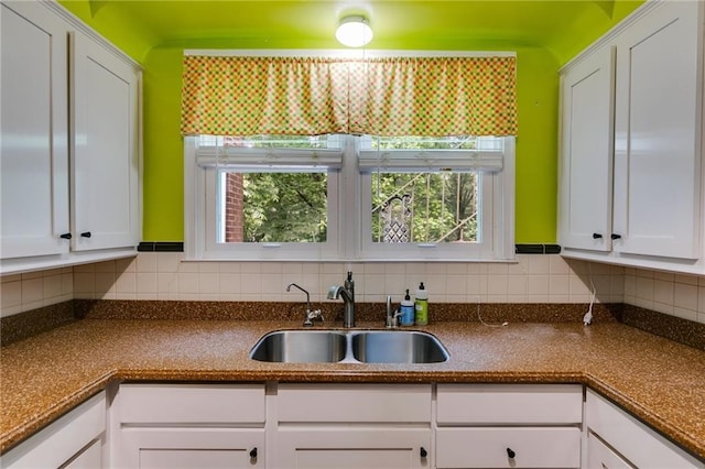 407 E College St E, Bowdon, GA 30108 - kitchen with white cabinets and backsplash